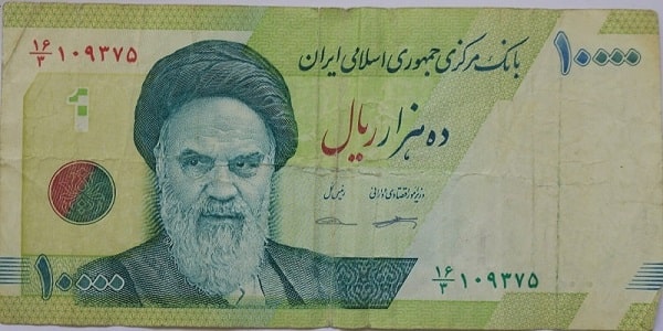 difference between rial and toman